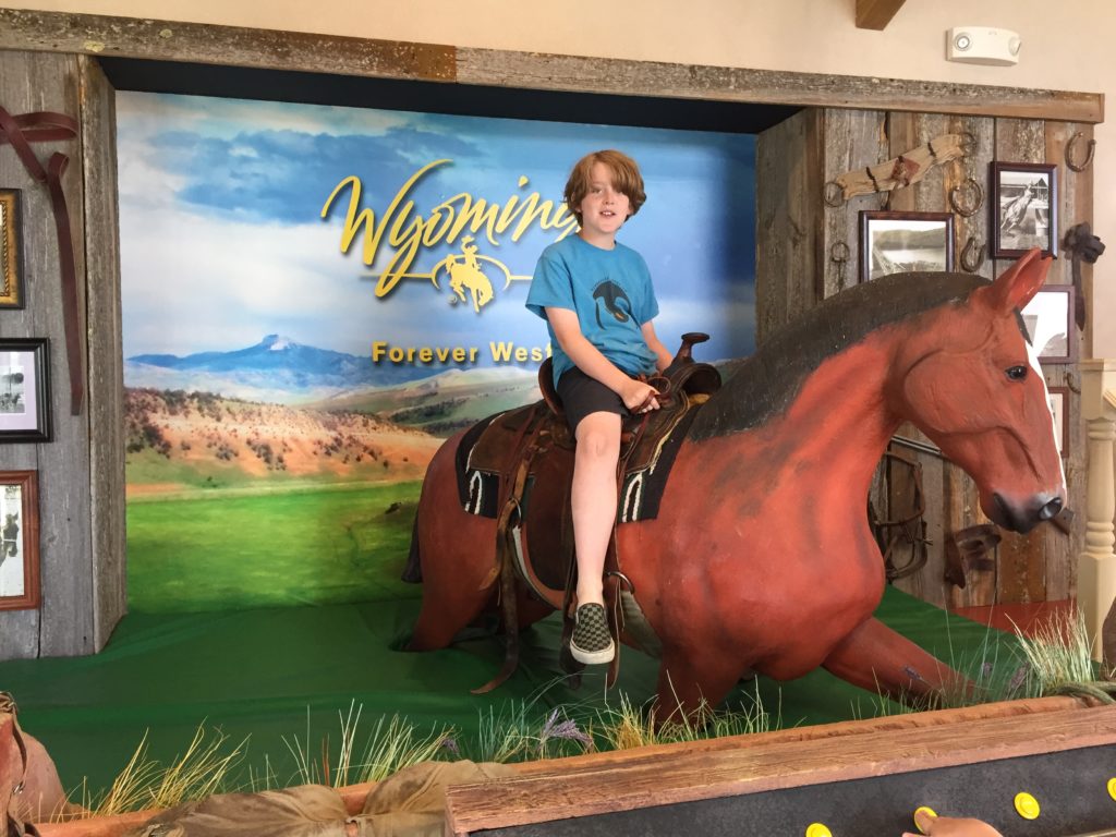 riding a horse at the Wyoming Welcome center on I-90