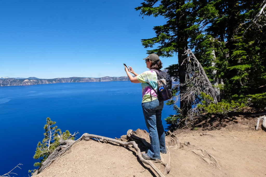 Amy taking photo of Crater Lake