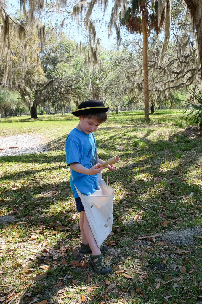 Playing with a colonial toy at Fort Frederica