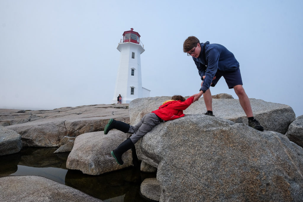 playing on rocks at Peggy's Cove