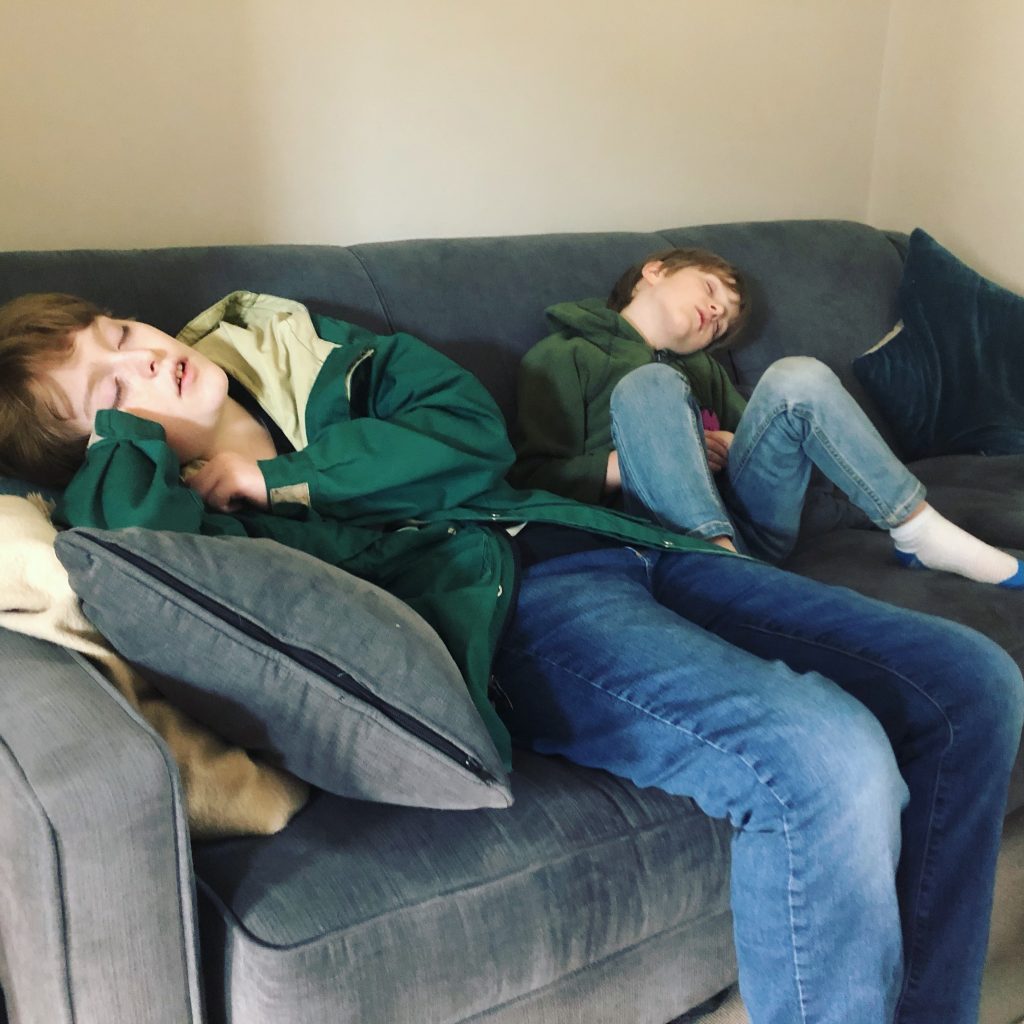 kids asleep on sofa