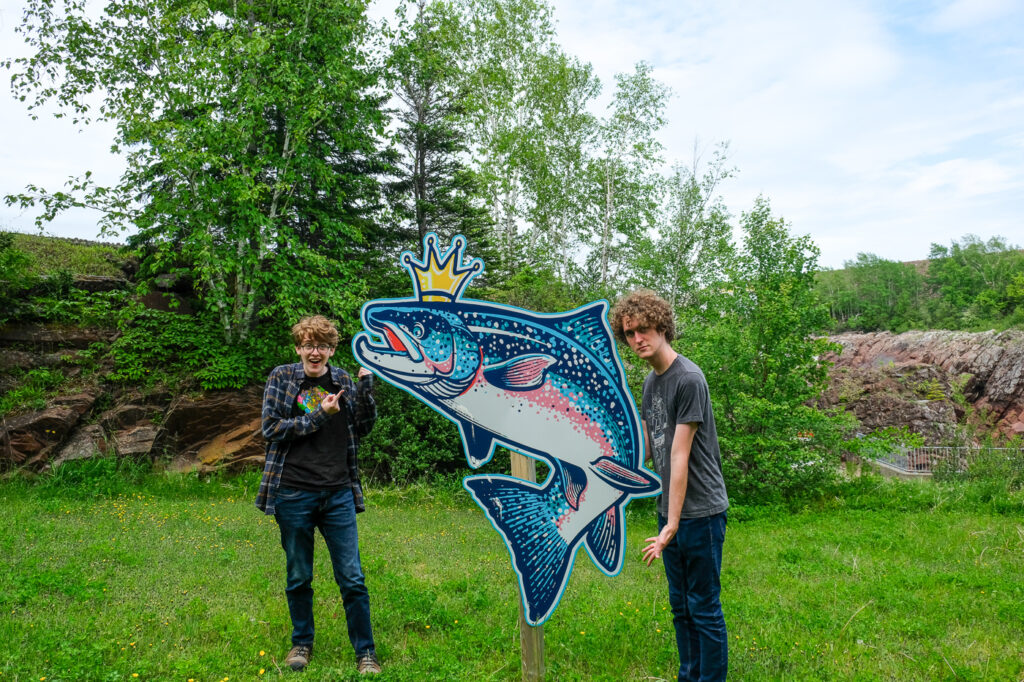 Gus and Milo posing with a salmon