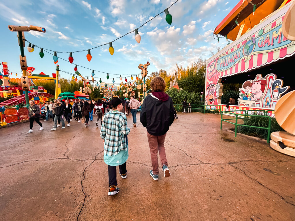 Abe and August walking in Toy Story Land